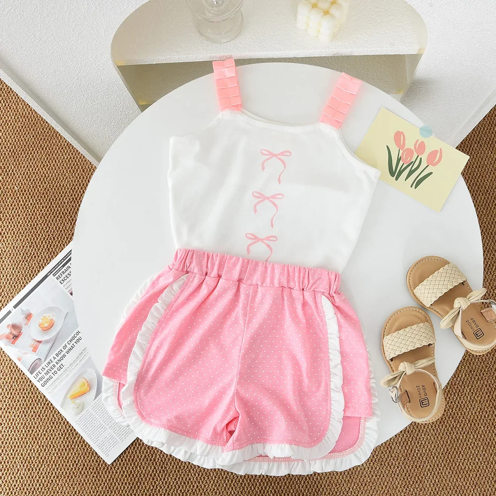 

Новинка лета для девочек 3-7 лет, модная милая одежда, милый топ на подтяжках с бантом и принтом + шорты, комплект из 2 предметов, детская повседневная одежда на каждый день