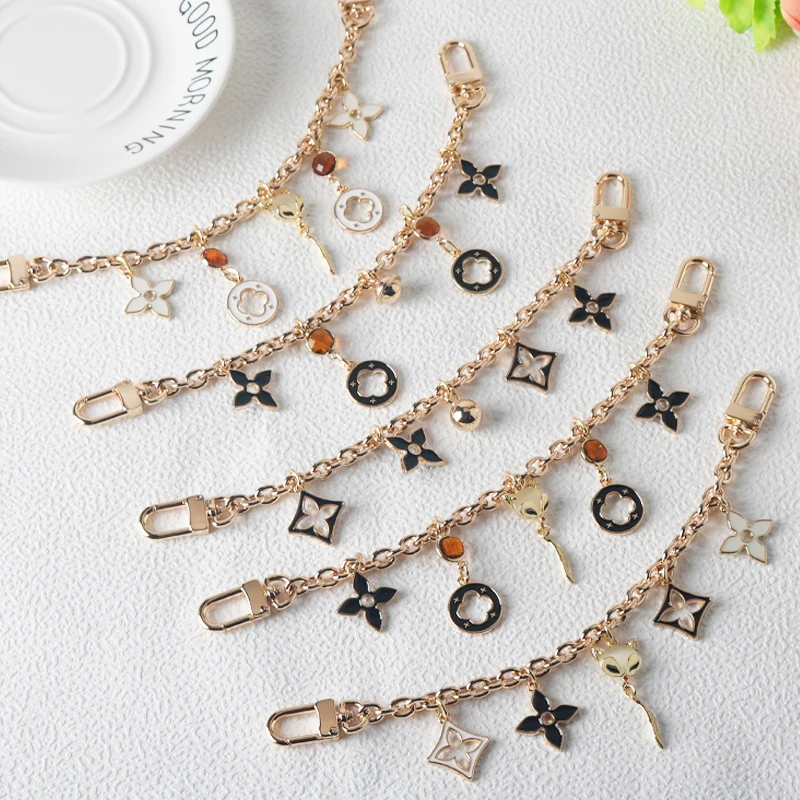 Fashion New Product Black and White Four Leaf Old Flower Trendy Jewelry Bag Decoration Chain Phone Decoration Pendant Accessory image 2