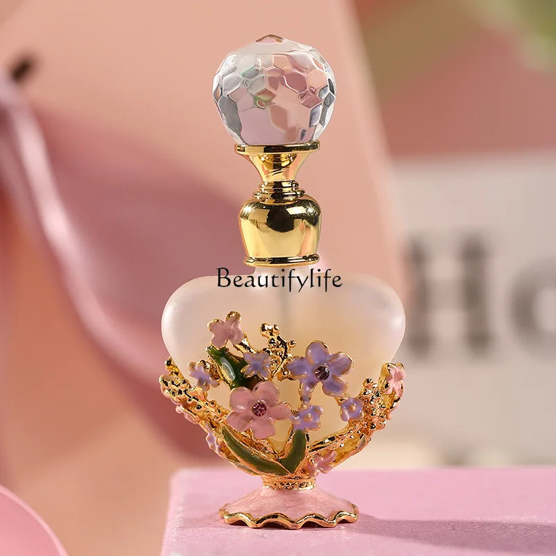

5 milliliter flower shaped bottle with exquisite drip glue edging, empty bottle