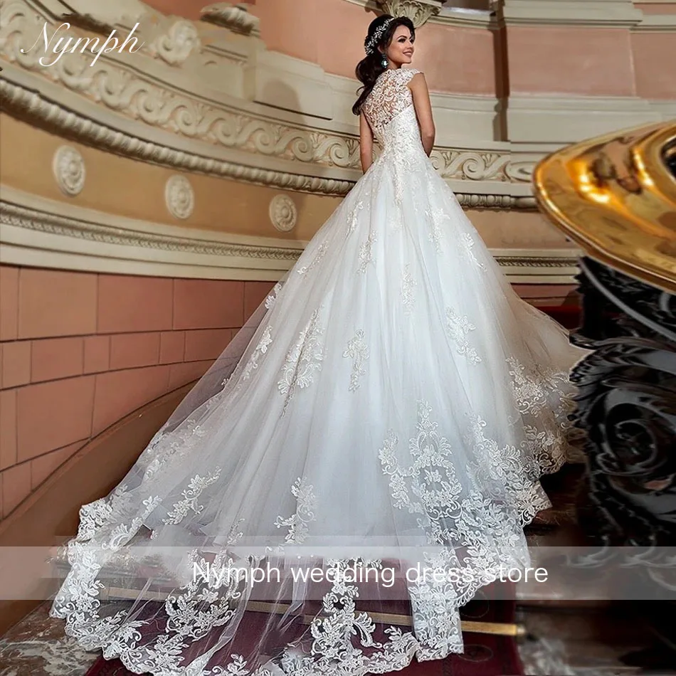 ヴィンテージチュール V ネックレースのウェディングドレス Vestido De Noiva ノースリーブ A ラインアップリケボタンウェディングドレスローブデマリー