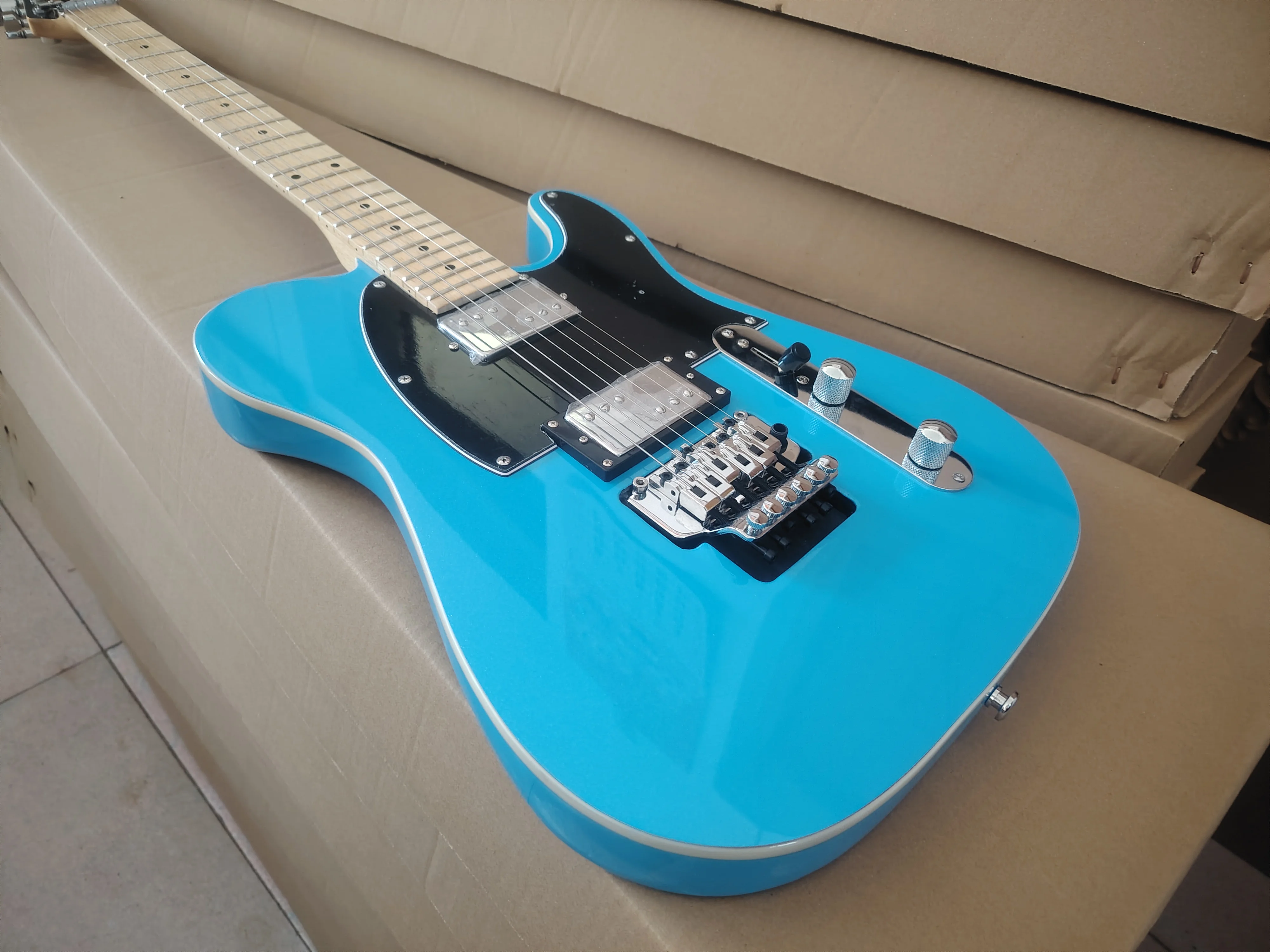 High quality blue silver powder particle electric guitar in stock, Freud vibrato system, fast delivery