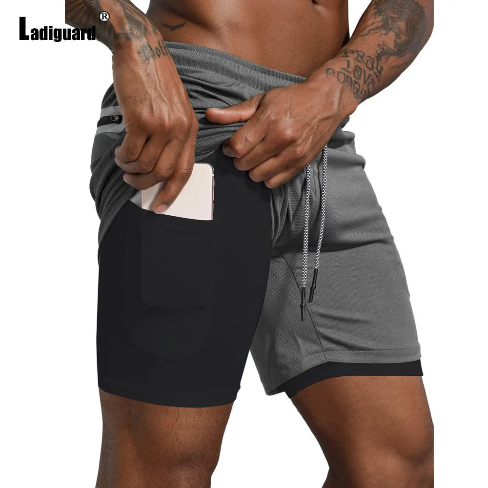 2025 Pantaloncini da corsa sportivi casual con tasca alla coreana da uomo Nuovi pantaloncini da spiaggia estivi Pantaloni corti da fitness da uomo Abbigliamento da uomo sexy Taglie forti