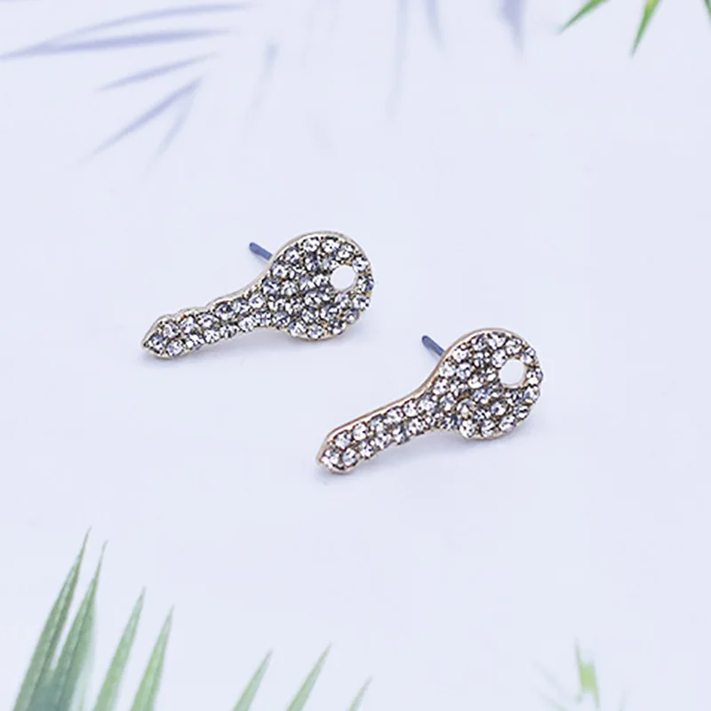 The key-shaped stud earrings are set with gemstones and are exquisitely designed, making them perfect for daily wear as a lady's
