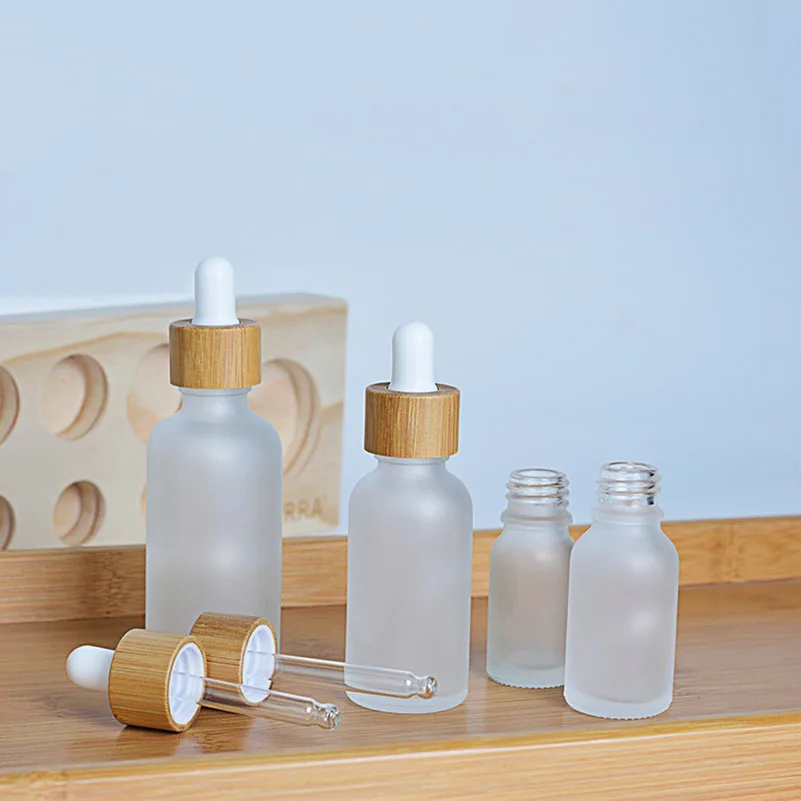 

24Pcs/lot 5/10/15/30/50ml Frosted Dropper Glass Bottle With Bamo Lid Empty Refillable Glass Pipette Bottle For Essential Oil