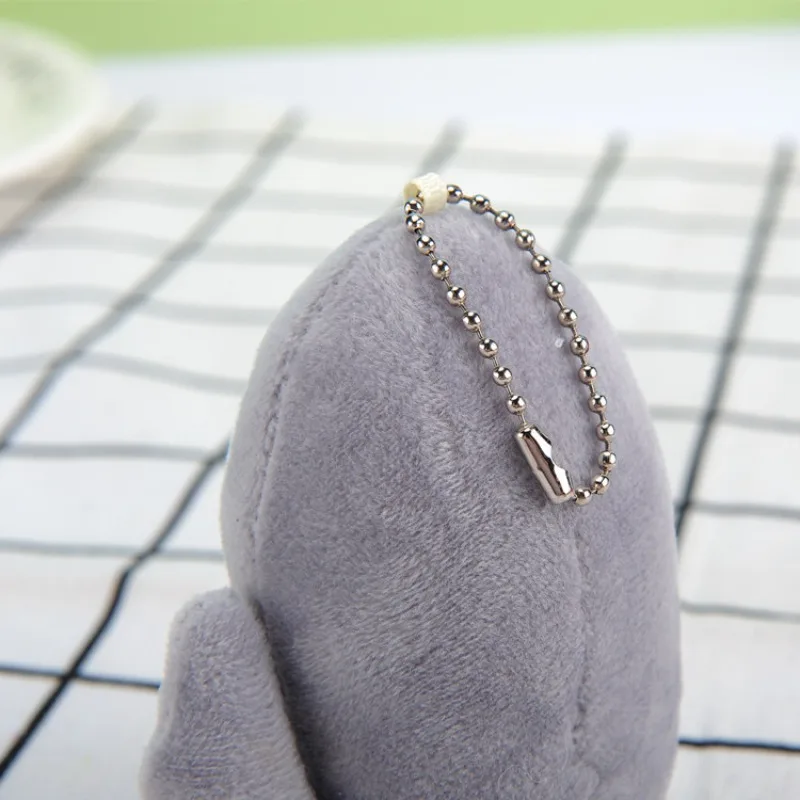 10 Cm tiburón sosteniendo dinero mochila de felpa colgante novedoso llavero de coche colgante de equipaje de dibujos animados de felpa muñeca divertida regalo de mano