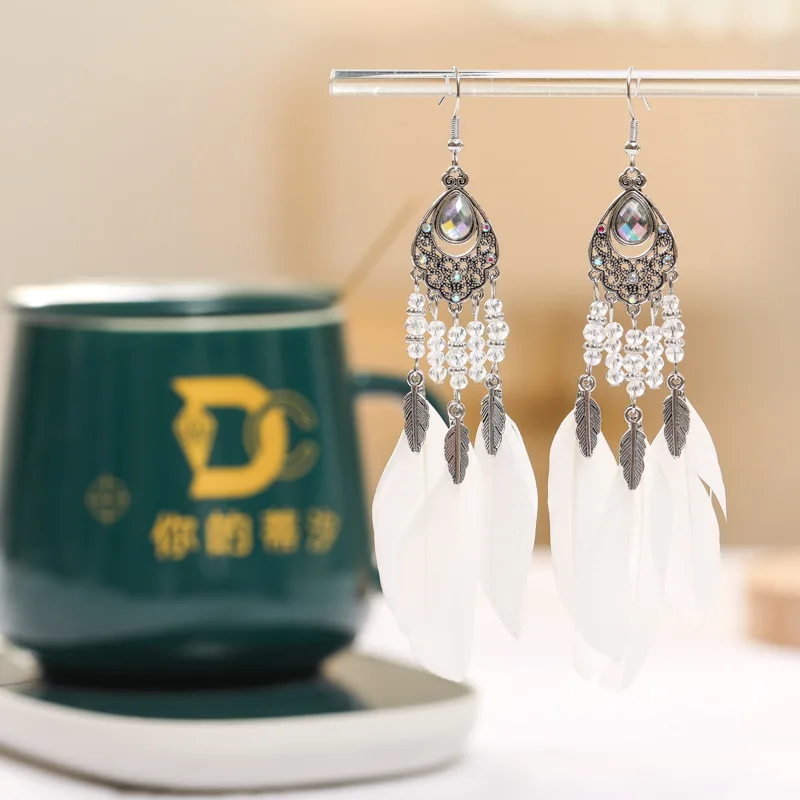 2026 الخاص بك Tixi البيضاوي مزاجه ريشة أقراط العرقية نمط كريستال أقراط Yunguichuan السفر المجوهرات بالجملة