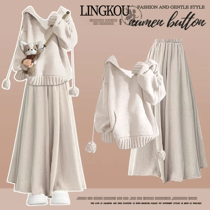 

Комплект из трех предметов: худи большого размера, белые широкие брюки и топ в повседневном стиле. Модный свободный крой.