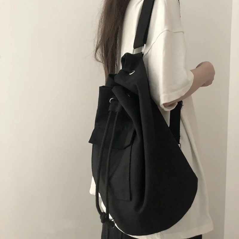 Large capacity bucket bag Korean version Ins early autumn pocket canvas drawstring diagonal shoulder bag for men and women