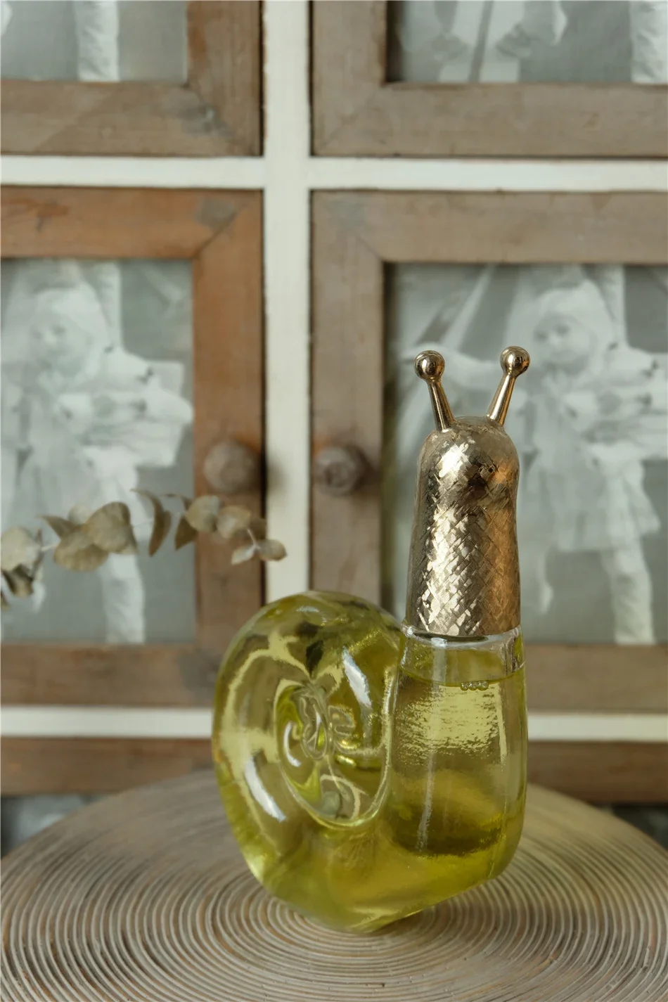 Antique groceries, perfume bottle, bath oil, snail shape, with original box.