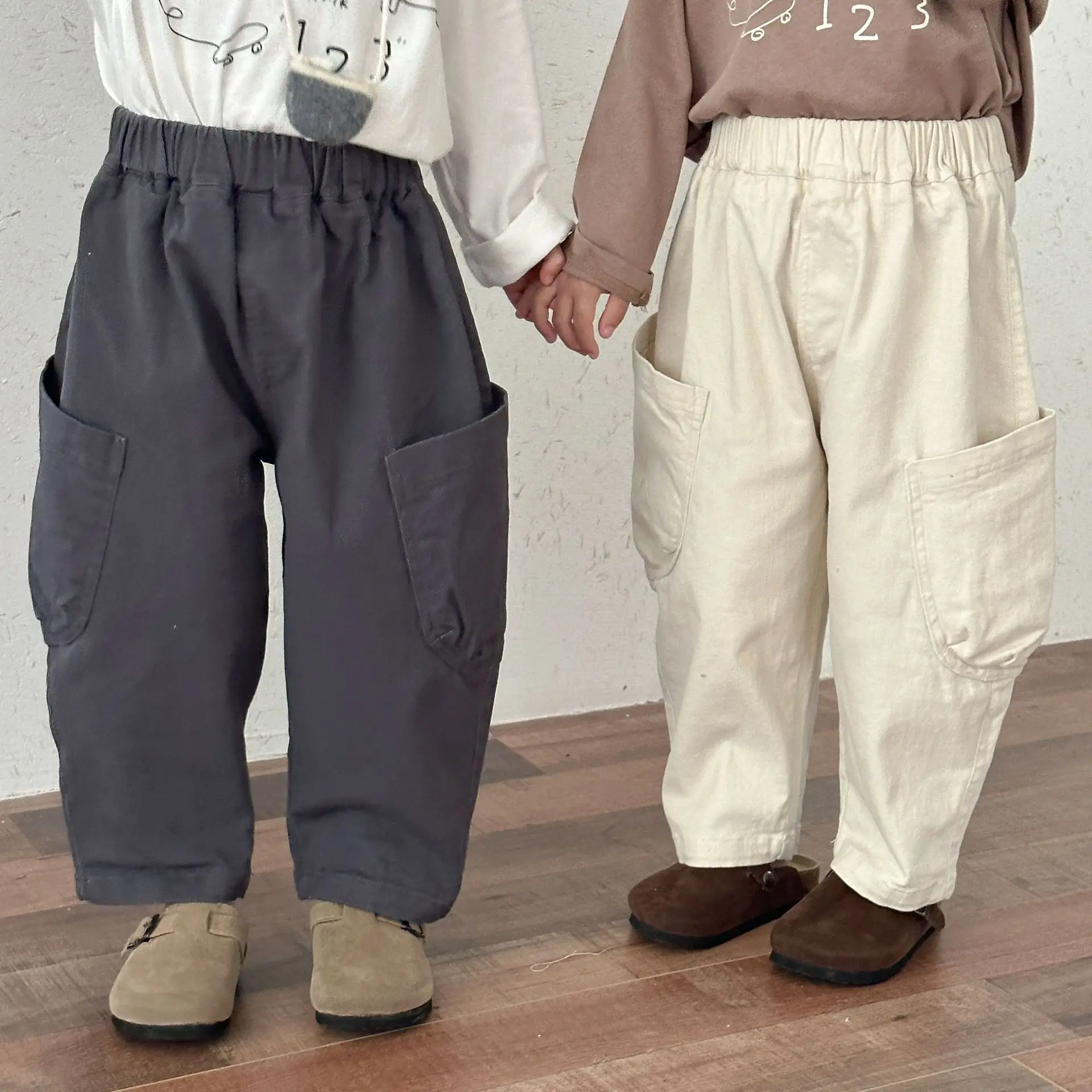 2025 nueva primavera otoño niños pantalones elásticos sueltos sólidos bolsillo algodón bebés pantalones casuales niños pantalones