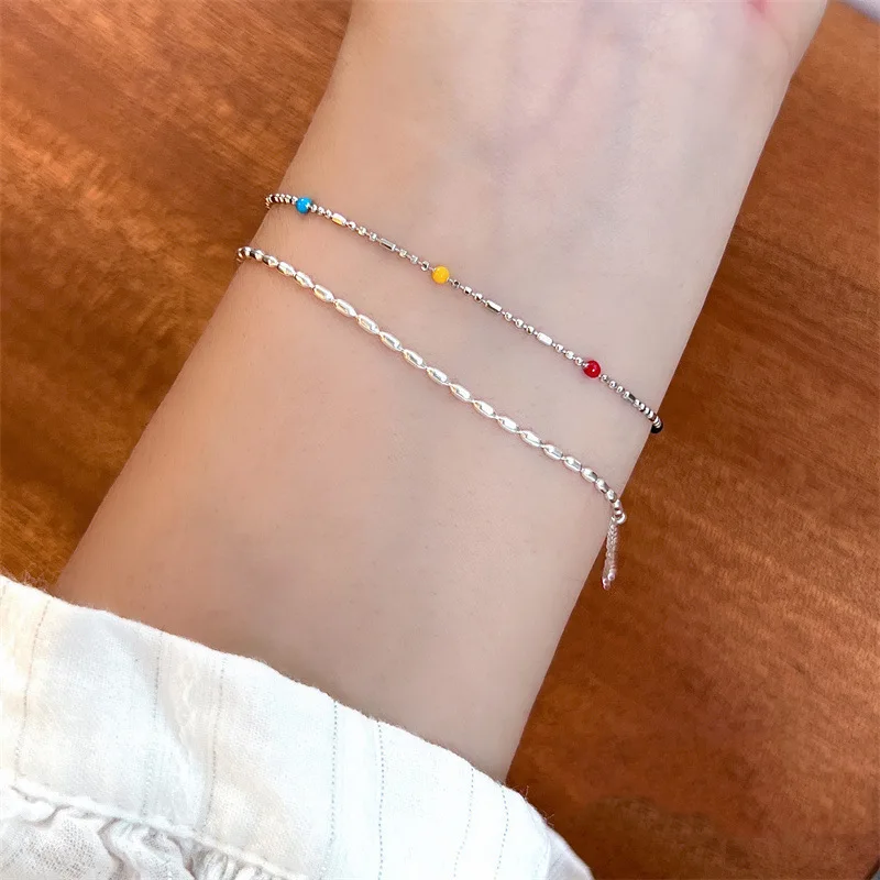 สร้อยข้อมือถั่วสีสันสดใสพร้อมดีไซน์เฉพาะตัวของผู้หญิง สวมทับซ้อนกันแบบหยดเคลือบ จับคู่กับเครื่องประดับแฟน Ins ใหม่ปี 2023