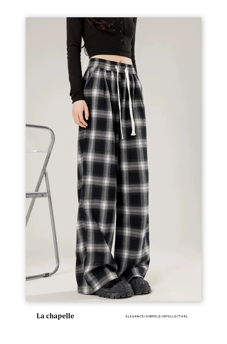 女性用の特大の黒い市松模様のスウェットパンツ,だぶだぶのカジュアルパンツ,伸縮性のあるウエスト,ポケット,学生,ユニセックス,ヒップホップ,ルーズフィット,ファッション