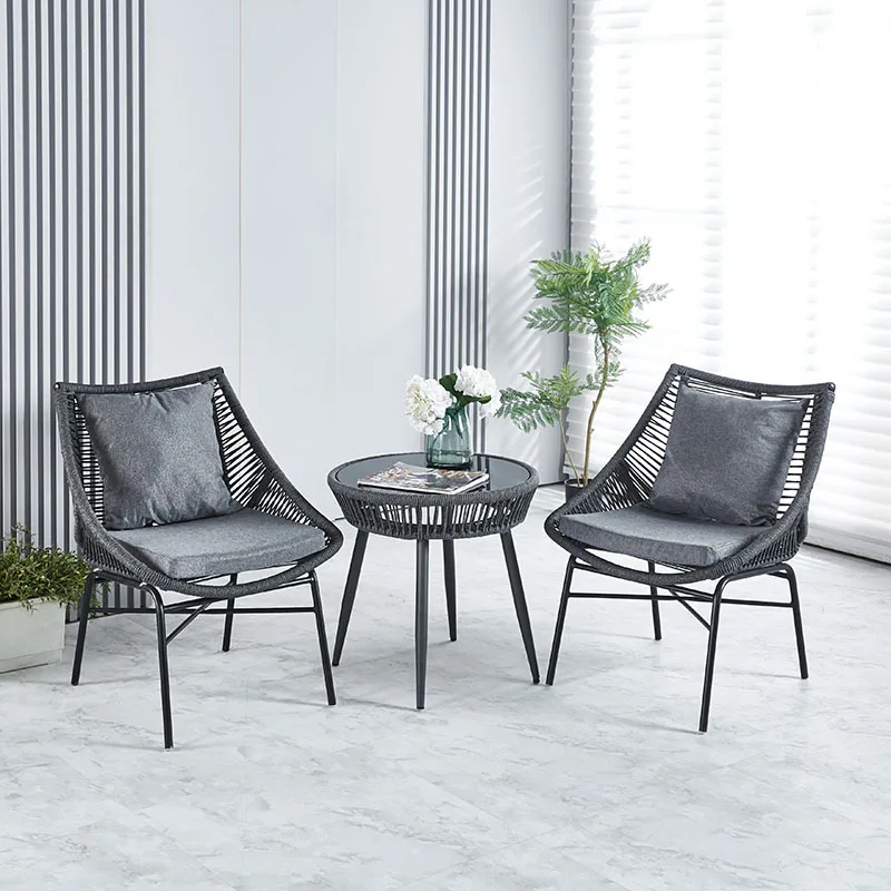 

Waterproof outdoor tables and chairs Internet celebrity balcony rattan chair tea table three-piece set Garden garden leisure