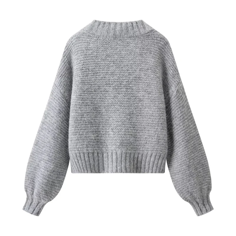 Korte, eenvoudige, effen gebreide damestrui voor de herfst van 2025, modetrends