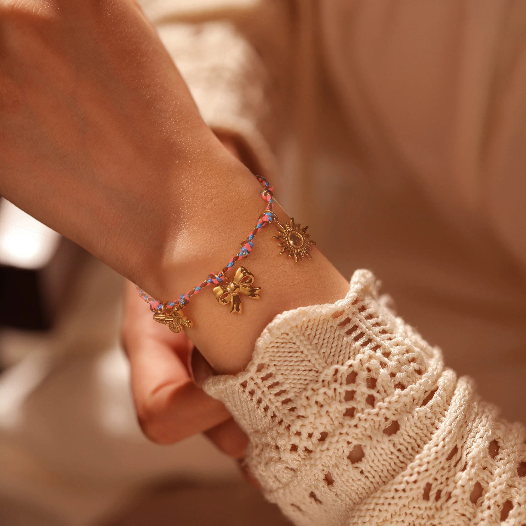 Golden Tone Braided Cord Charm Bracelet with Butterfly Bow and Sun Pendants for Women