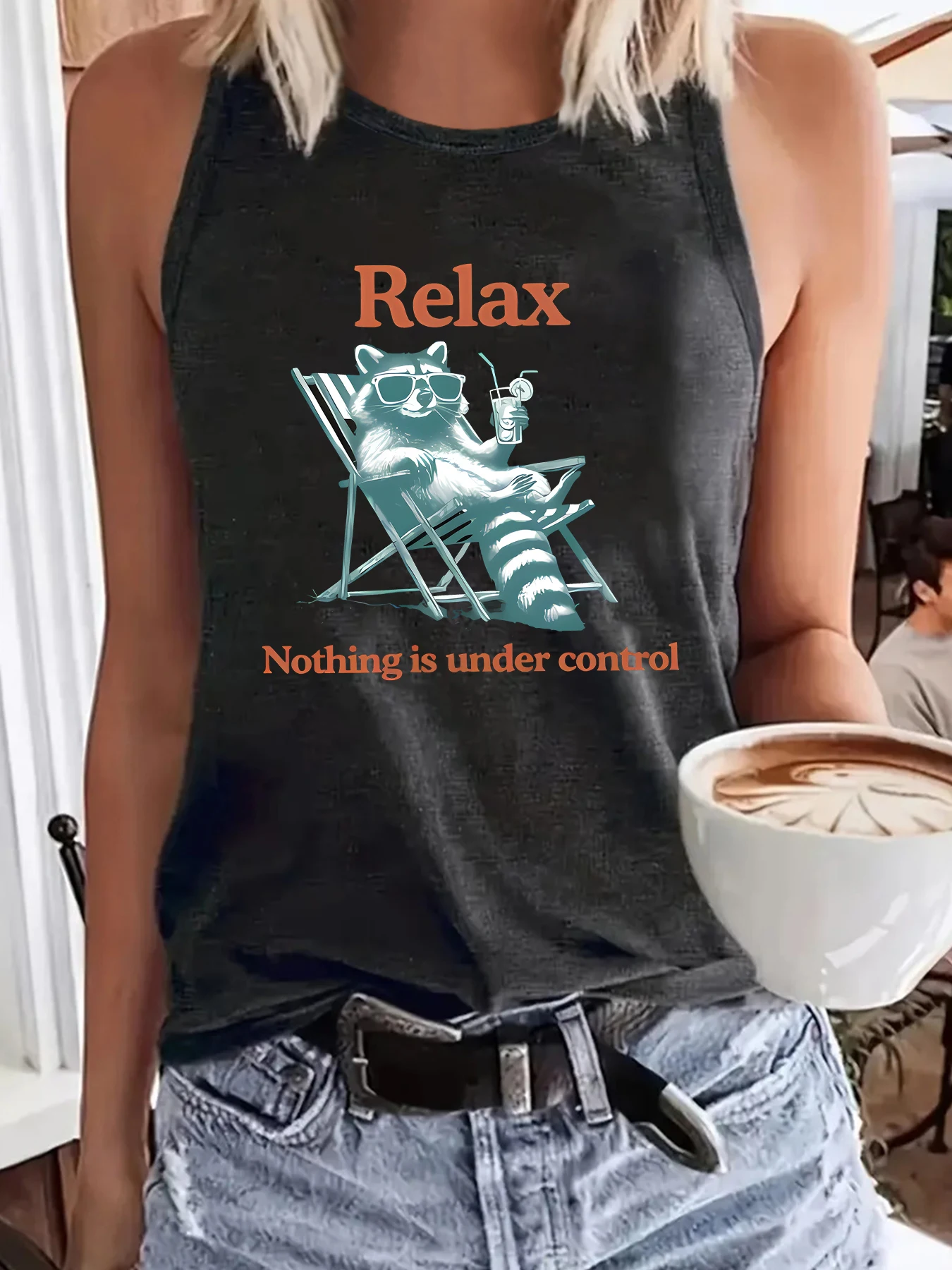Women's sleeveless hurdle print tank top, with the Relax slogan and sunglasses, drinking beverage, and raccoon cartoon print.