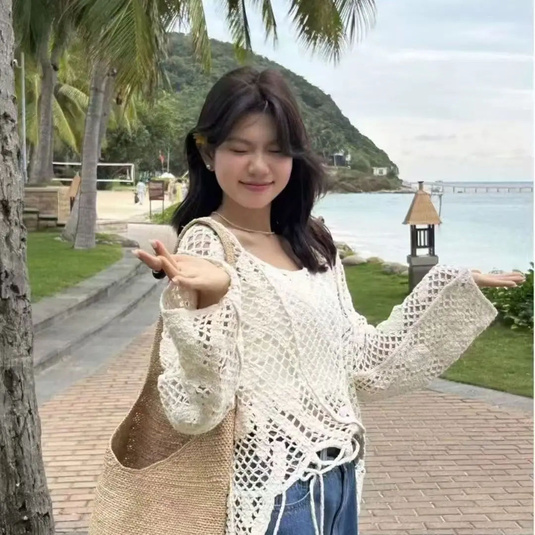 2026 neue Große Lose Sonnencreme Mm Design Hohl Haken Blume Langarm Gestrickte Hemd Abdeckung Top Frauen Äußere