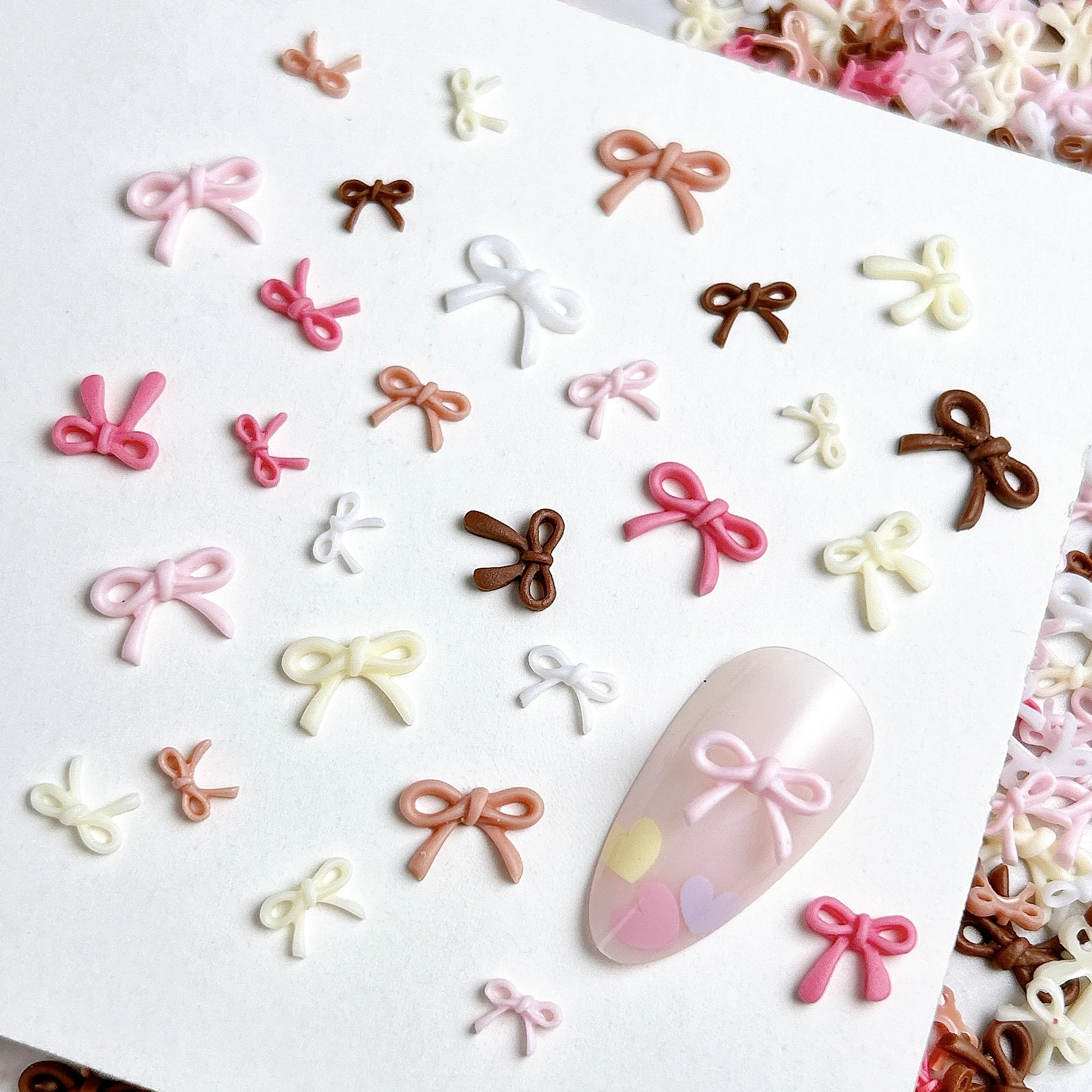 50PCS Sweet Solid Color Line Bows Nail Charms Multi Sized Hollowed Bowknots Resin Nail Art Decorations for DIY Nails Ornaments