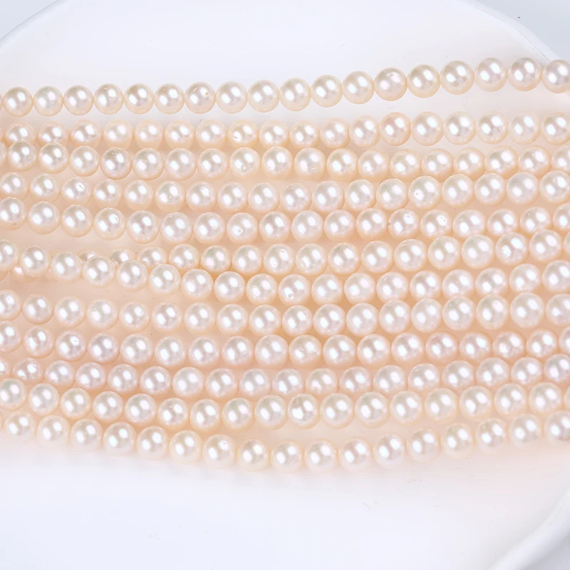 

Natural Color White 7-8mm Round Shape Freshwater Pearl Strands