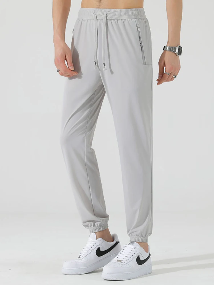 Pantalones de chándal finos de seda de hielo para hombre, pantalón de chándal informal de nailon elástico de secado rápido, novedad de verano, 2024