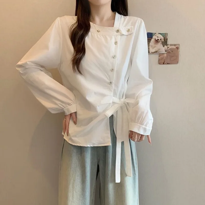 Femme Primavera Estate Tendenza moda coreana Bottoni Tinta unita O-Collo Camicie da donna Pullover a maniche lunghe con coulisse alla moda