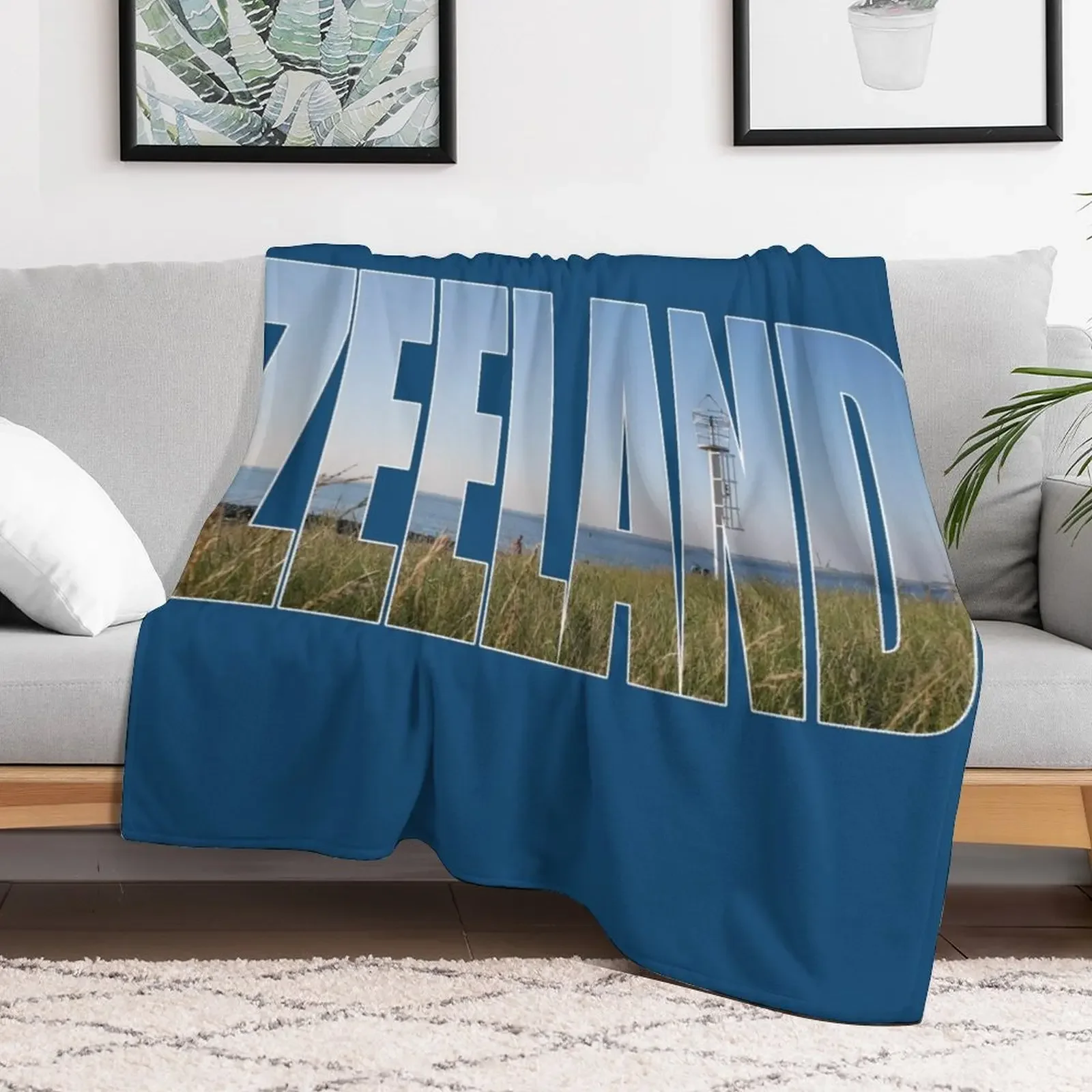 Text Zeeland with overlay of a land and sea landscape in a photo of zeeland in the Netherlands Throw Blanket