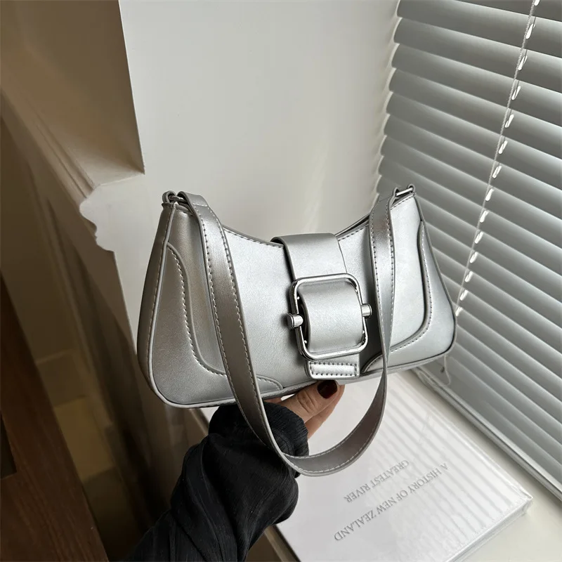 

French-Inspired Underarm Bag. Features a sleek belt-buckle design & vintage charm for elevated everyday elegance.