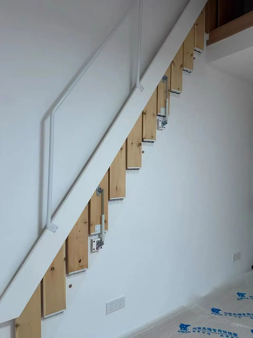 Custom-made hidden wall-mounted retractable folding staircase in solid wood for attics