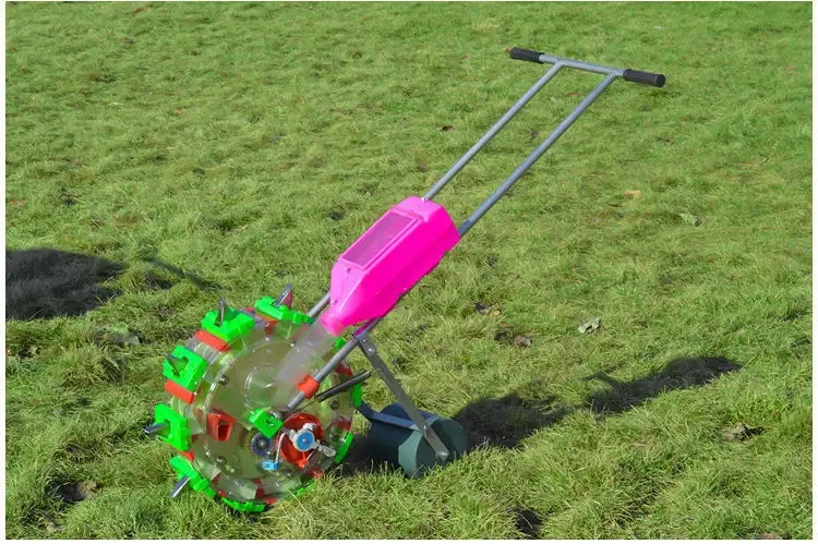 Manual hand push corn seeder with fertilizer