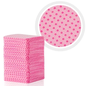 Stack of pink cleaning cloths with perforated texture. Close-up shows dotted pattern. Absorbent material suitable for household cleaning tasks.