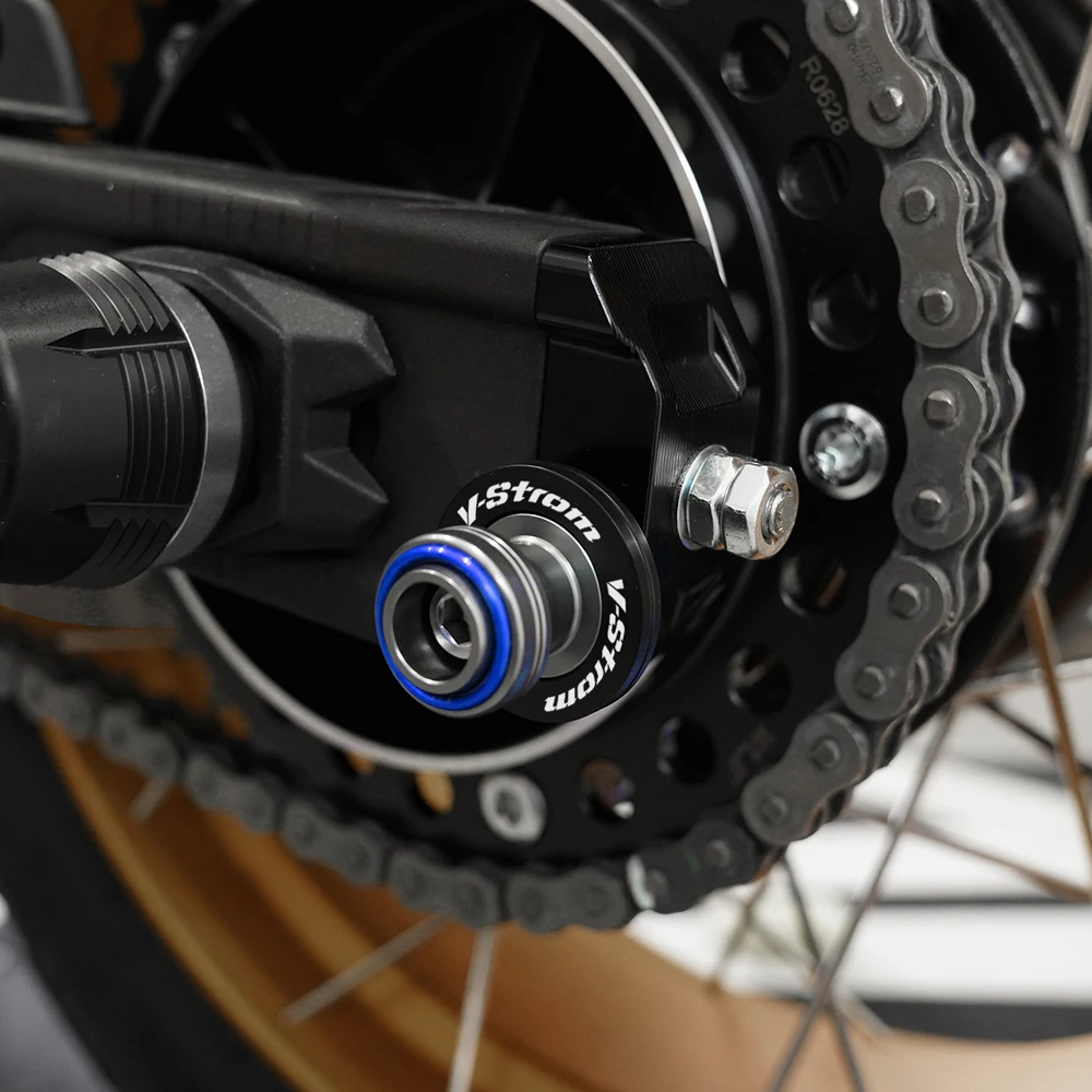 لسوزوكي فستروم 800DE 1050DE V-StromV ستروم 650 1000 1050 XT دراجة نارية Swingarm بكرات المنزلق حامل مسامير قبعات صمام الإطارات