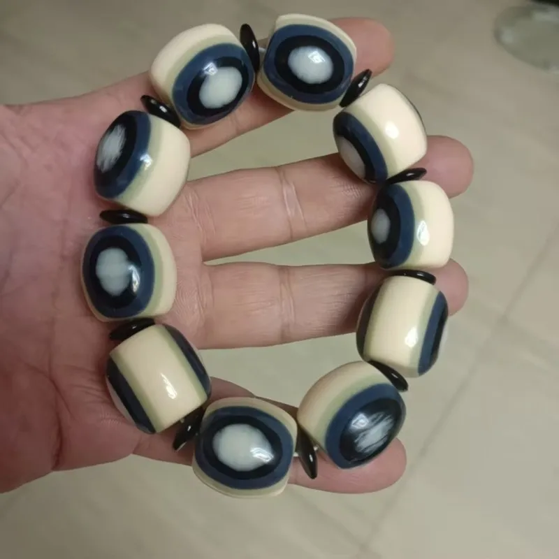 New craft tube bead bracelet with eye-shaped amber beads