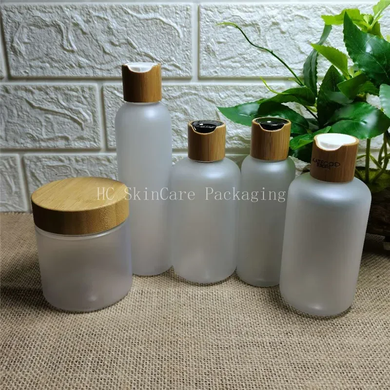 

Frosted plastic emulsion bottle disc cap skincare tools Cosmetic packaging containers with wooden bamboo cap plasticlotionbottle