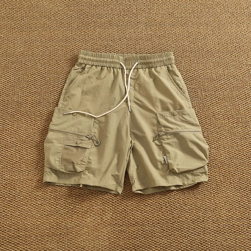 شورت سريع الجفاف للرجال بنمط جديد شورت عمل عصري وفضفاض للرجال صيفي متعدد الاستخدامات سروال خمس نقاط غير رسمي