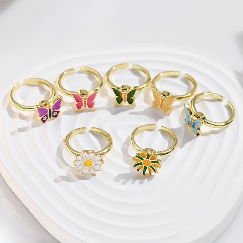 

New adjustable open ring and rotating five-petal flower butterfly ring