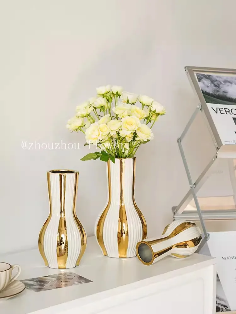 Advanced and minimalist gold painted ceramic vases, water-based rose flower arrangements, dining room, living room, soft floral