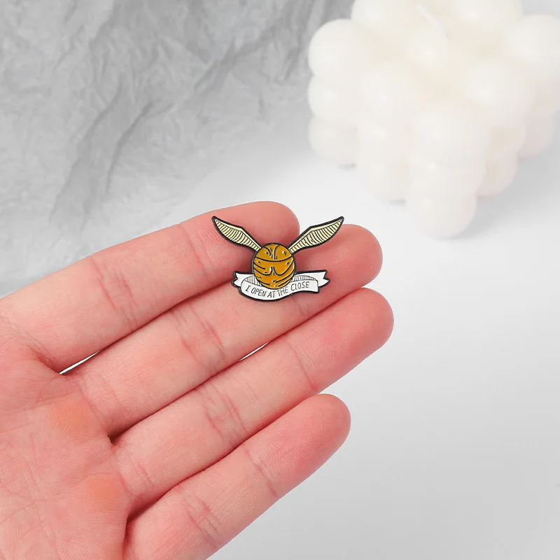 Golden Snitch Enamel Pins Creative Ball with Wings Brooch Bag Lapel Button Badge Funny Movie Jewelry Gift for Kids Fans Friends