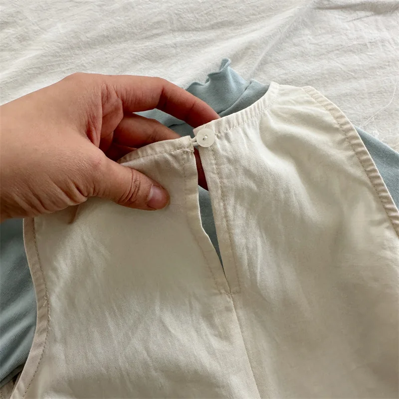 تنورة أنيقة للفتيات لعام 2025 بدون أكمام للربيع والخريف منتج جديد فستان فضفاض بلون سادة مكدس للأطفال