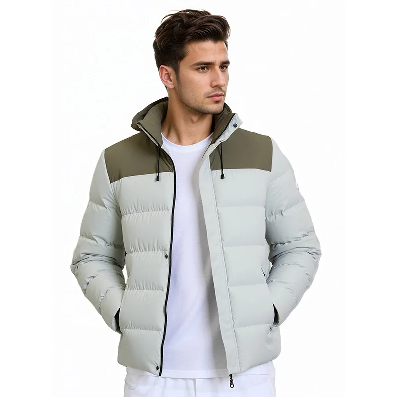 La nueva chaqueta acolchada de algodón con capucha y bloques de color de invierno para hombre es informal y versátil, gruesa, cálida y elegante.