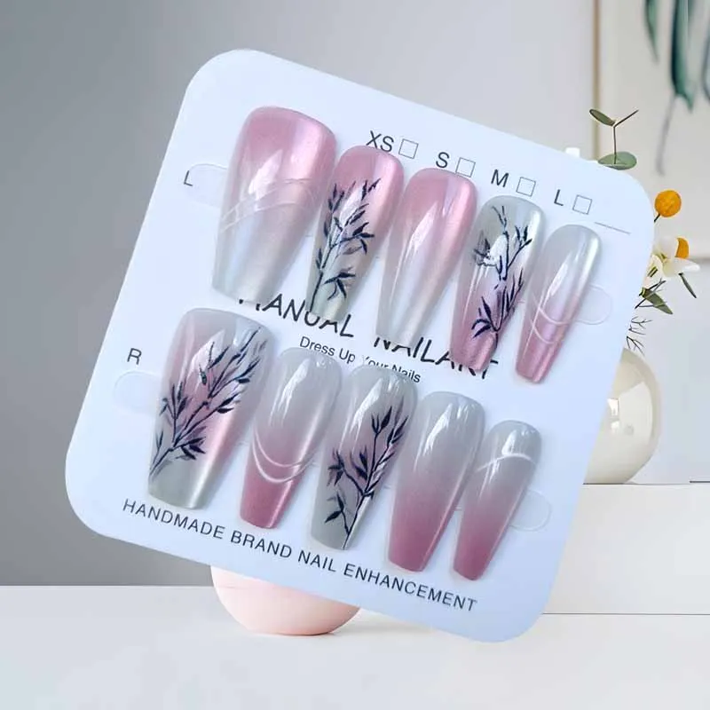 แผ่นแปะเล็บปลอมทรงหยดน้ำยาว 10 ชิ้น สีชมพูอ่อนไล่ระดับสีม่วงทอง ลายตาแมว