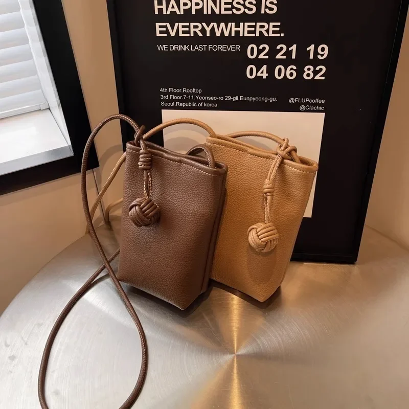 Versatile artistic small fresh small round ball pendant crossbody phone bag, soft leather cute mini bag for women view 4