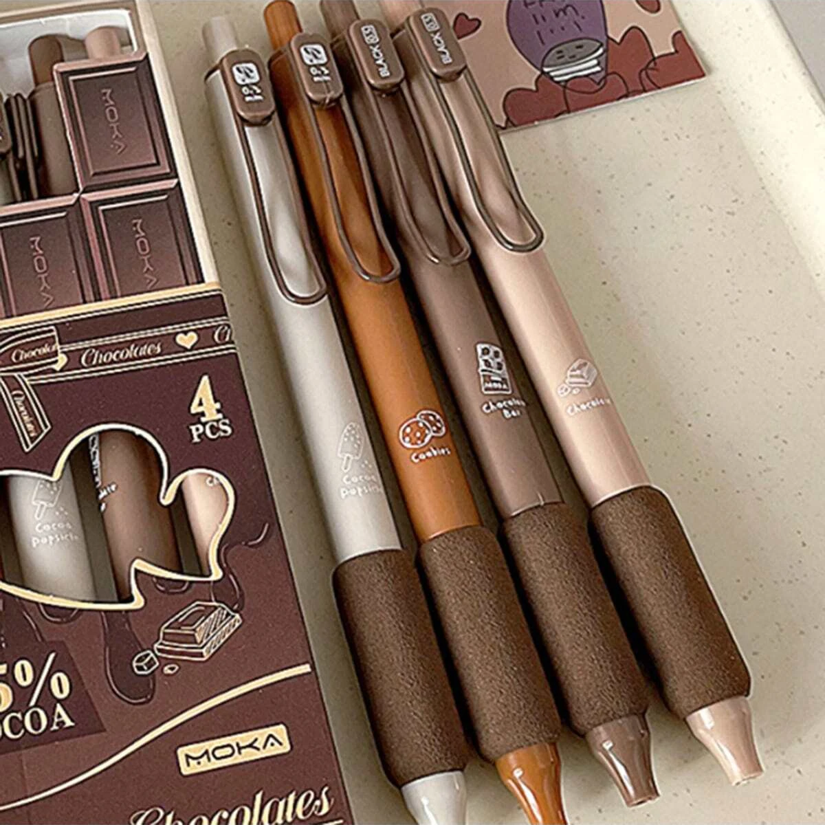 

A box of 4 limited edition Mocha chocolate soft a neutral pen, a press type black carbon brush, and super smooth question pens
