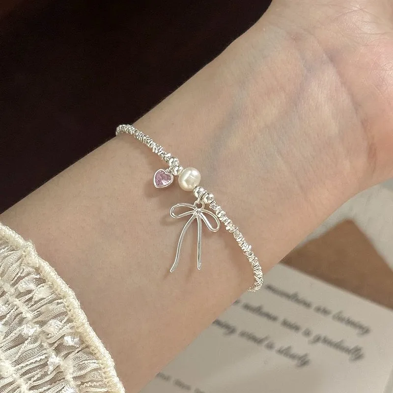 سوار على شكل قلب وردي من الفضة الإسترليني عيار 925 للنساء، سلسلة مجوهرات أنيقة على شكل فيونكة من اللؤلؤ هدية لحفلات أعياد ميلادها