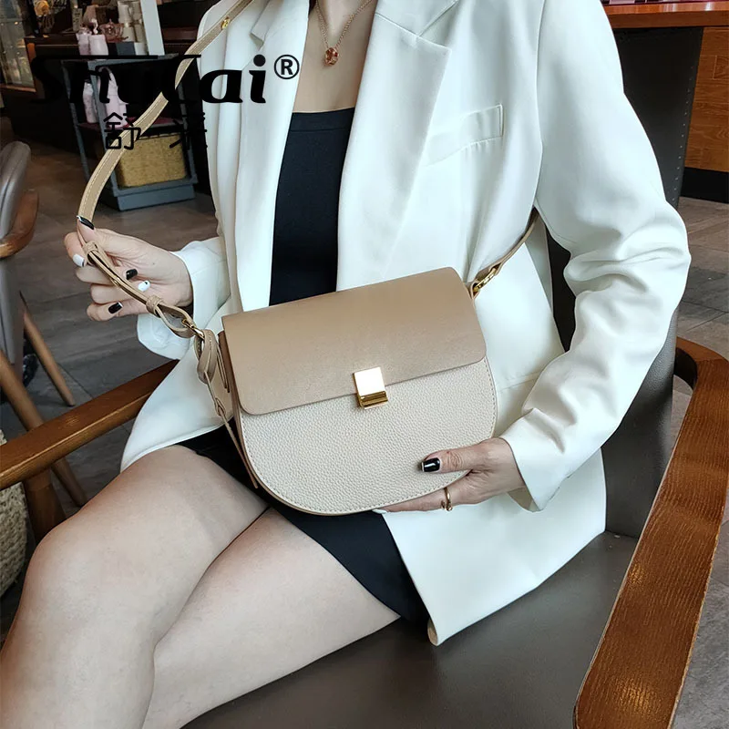 

Saddle bag female 2024 new single shoulder crossbody fashion hit color senior sense armpit genuine leather small bag