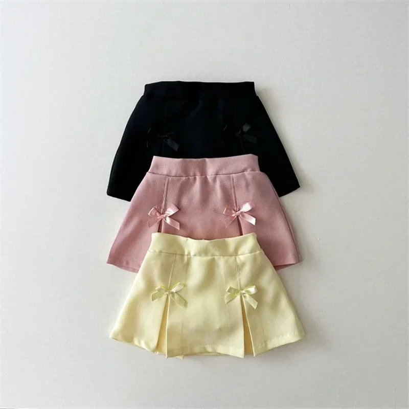 Korean version of spring and autumn girls' cute cotton pleated bow, solid color, fashionable and versatile pleated skirt