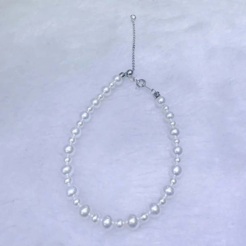 

Браслет из стерлингового серебра с натуральным пресноводным жемчугом диаметром 35 мм рядом с круглым серебром