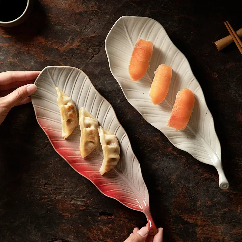 

Japanese retro kiln leaves sushi plate commercial ceramic snack plate jiaozi sashimi long plate saury plate.