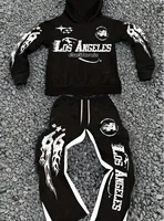 Conjunto con capucha informal y elegante de estilo callejero para hombre con franjas de color negro y blanco y estampado del alfabeto de Los Ángeles