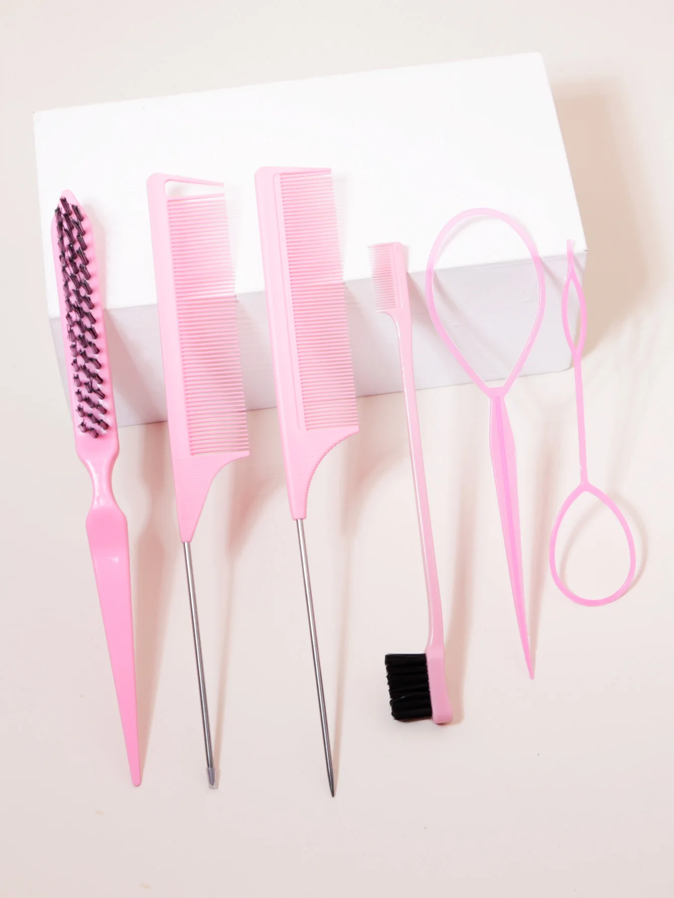 Styling set, including nylon hair brush, two steel needle pointed tail combs, edge control brush, and two hair tail tools