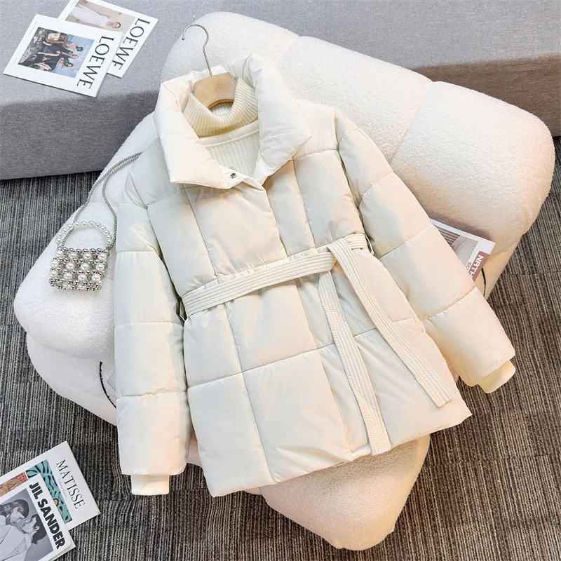 Chaqueta de plumón de invierno para mujer, chaquetas acolchadas de algodón ruso, cinturón delgado, temperamento, Parka larga gruesa y cálida, prendas de vestir holgadas y ajustadas, tendencia